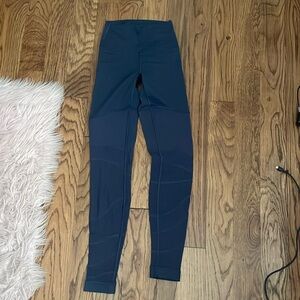 Purple Lululemon Leggings. Mesh at bottom.